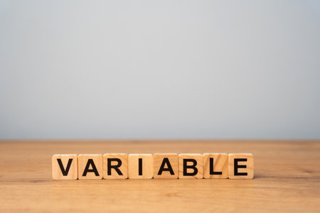 Wooden blocks with the word variable. Variability, variation, flexibility and change in business concept.の写真素材