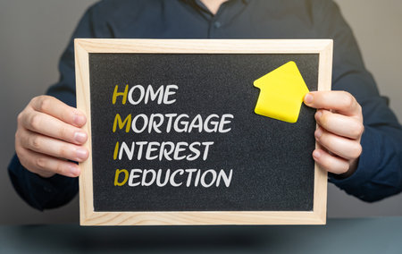 Home mortgage interest deduction concept. Tax benefit that allows homeowners to deduct interest paid on a qualified mortgage for a primary or secondary residence from their taxable income.の写真素材