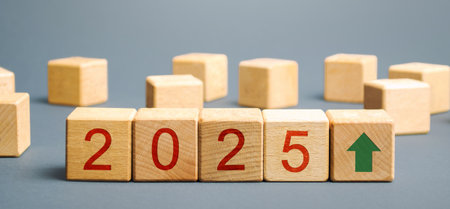 Wooden blocks with the inscription 2025 and arrow up. Setting goals and objectives for the new year. Planning, business management and strategy concept. Ideas, forecasting and visionの写真素材