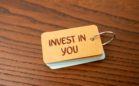Notes invest in you. Dedicating time and resources to improve personal, professional, and financial well-being. Pursuing education, improving health and wellness, setting financial goalsの写真素材