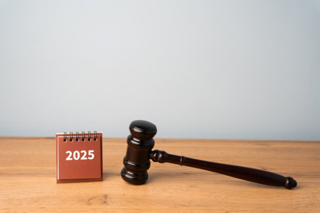 Judge's hammer or gavel and calendar 2025. Concept of planning and management in the legal sphere. Court, law and judgmentの写真素材