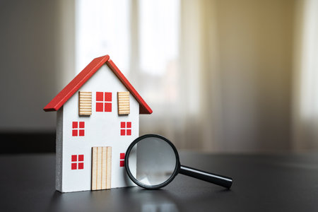 Magnifying glass and house. House searching concept. Home appraisal. Property valuation. Choice of location for the construction. Search for housing, apartments. Real estate appraiserの写真素材