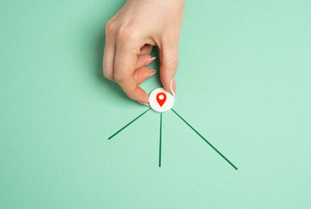 Hand with geolocation icon and new directions for next destinations. Navigation, exploring new...