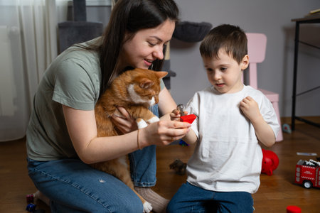 Mother and child play at home. Social bonding, learning through fun, and enhancing early development skills. Emotional connection through family activities.の写真素材