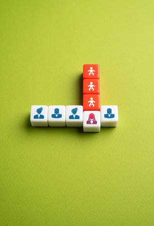 The difficulties of building a career for a woman with children. Balancing motherhood and professional growth. Childcare responsibilities, and workplace biases can hinder career advancementの写真素材