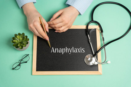 Anaphylaxis concept. Serious, potentially fatal allergic reaction and medical emergency that is rapid in onset and requires immediate medical attention. Woman writes on the board near the stethoscopeの写真素材