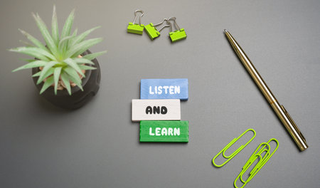 Listen and learn inscription. Phrase that encourages the idea that by paying attention and actively listening, you can gain knowledge and improve your understanding of a subject or situation. Blocksの写真素材
