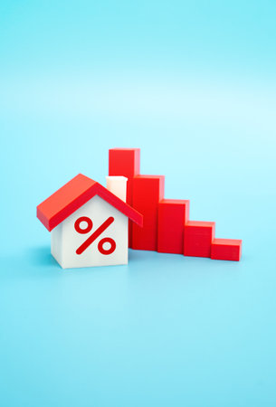 Home and the falling trend of real estate values. Market correction, reduced property value, or shifting housing market conditions.の写真素材