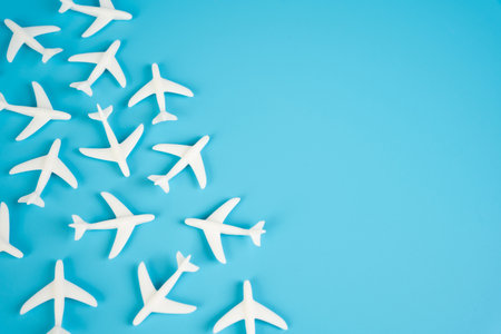 Passenger airplane figurines and space for text. Civil flights. Commercial flights, or airline industry announcements. Booking and travel.の写真素材