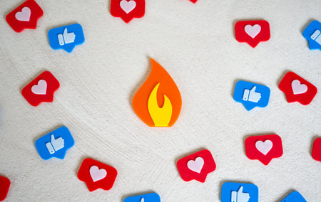 Flame figurine trending among social media likes. Viral event, memes and news. Digital trends, or online controversy. Content going viral, attention economy, or the firestorm of public opinion.の写真素材