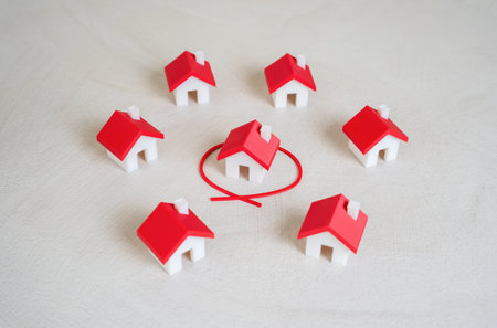 One house is outlined in red among many. Select from all options. Ideal property, or top-rated listing in a housing market.の写真素材