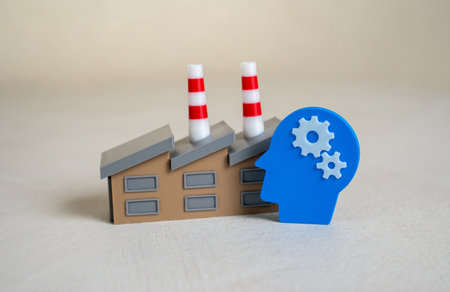 Industrial plant and symbol of human thought. Creativity and engineering technology. R&D, smart factories, engineering solutions, or technological transformation.の写真素材