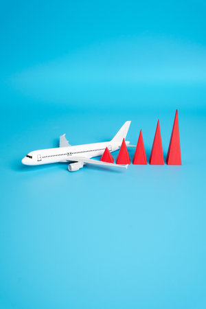 Airplane and growth chart. Increase in passenger traffic. Growth in civil aviation, travel demand, or tourism recovery. Investment in airlines, airport expansion, or global mobility trends.の写真素材