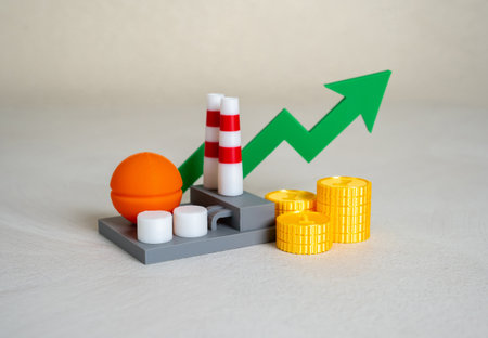 Industrial plant with stacks of money coins and green arrow pointing up. Chemical production income. Tax revenue from industry. Tax revenue, environmental sustainability, or production efficiency.の写真素材