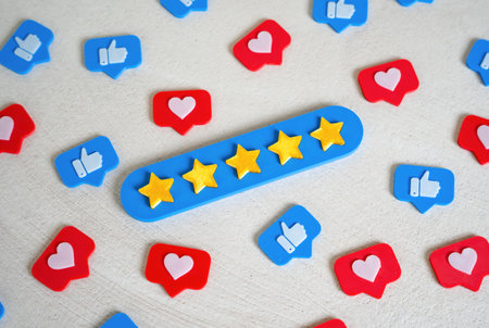 A five-star bar among social media likes. Social validation, high ratings, or quality recognition. Customer review metrics in digital marketing.の写真素材