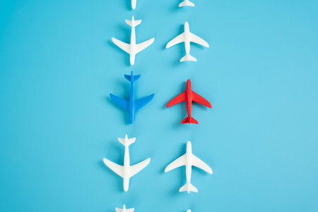 Two planes and two oppositely directed flows of aircraft. Competition in aerospace. Broader industry polarization. Competing airlinesの写真素材