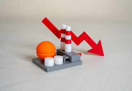 Industrial plant and red arrow down. Production decline, low revenue. Cost reduction. Credit rating...