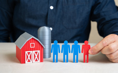 The man resolves the labor shortage in the agricultural sector. Workforce management in rural areas, hiring migrants, or promoting agri-robotics. Global food supply issuesの写真素材