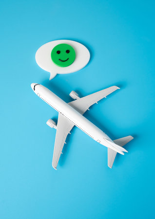 Airplane and face of good mood. Best airlines. Success in booking a ticket. Positive airline rankings, vacation anticipation, or travel convenience. Customer service excellenceの写真素材