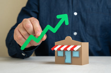 Shop and green arrow up. Business growth and expansion. Upward business momentum, rising profits, and market presence. Successful entrepreneurship, customer demand, brand scalabilityの写真素材