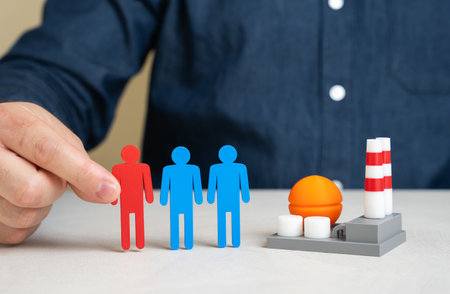 Shortage of workers in industry and energy sector. Hiring of migrant workers. Lack of qualified specialists. Labor market imbalance, skills gap, and dependence on migrant labor. Employment solutionsの写真素材