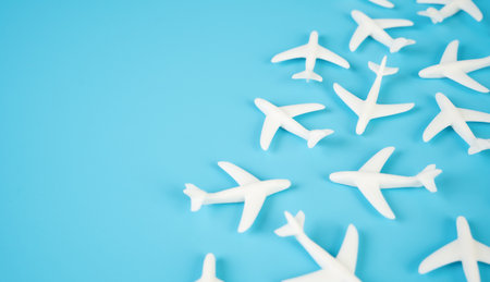 Airplane figures and space for text. Aviation industry. Flights and tourism. Air traffic growth, flight booking trends, airport infrastructure, or airline industry performance.の写真素材