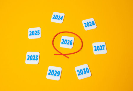 The year 2026 is outlined in red. Anticipation of economic events, innovation cycles, or deadlines tied to 2026. Planning, strategic focus, or future commitments.の写真素材