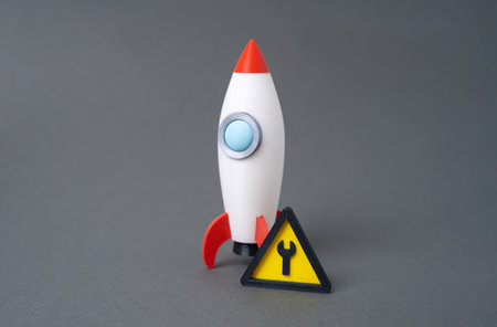 Rocket and repair sign. Startup in progress. Product under testing. Investor feedback processing.の写真素材