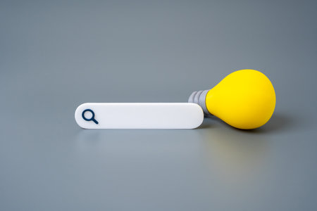 Search bar and light bulb idea. Online knowledge search. Digital solutions. Idea generation. Smart innovation. Access to information. Creativity through research.の写真素材