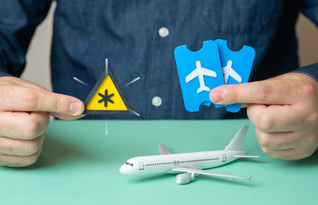 The man warns about important conditions for flight tickets and their return. Baggage restrictions, tricks of low-cost airlines. Travel rules. Refund policies. Extra fees. Budget airline risks.の写真素材