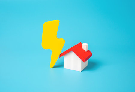 House and lightning. Concept of housing electrification, power supply with electricity. Consumer of electricity, economy and energy efficiency. Energy modernization. Sustainable living.の写真素材