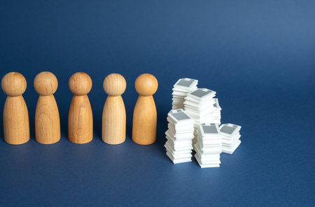 The accumulated paperwork that no one wants to sort out. Strong bureaucracy scares off new employees and discourages young professionalsの写真素材