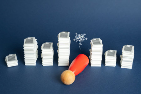 The human figure faints from high workloads, pressure from endless reporting requirements and unrealistic corporate expectationsの写真素材