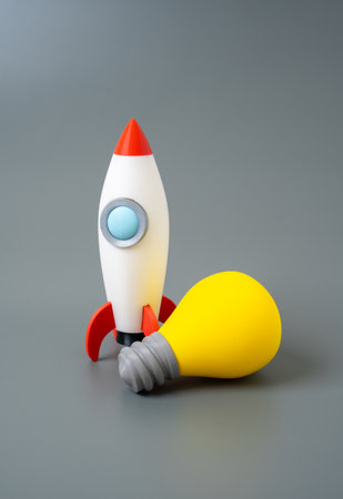 Rocket and light bulb. Concept of ideas and technologies. Startup development, innovation launch, new project, tech breakthrough, bringing creative ideas to lifeの写真素材