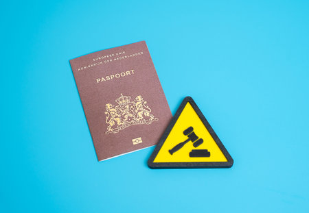 Netherlands citizen's passport and the symbol of the court process.の写真素材