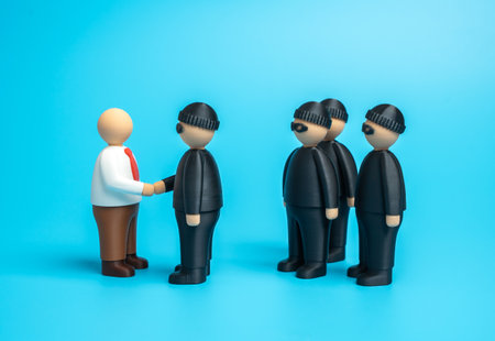 A corrupt politician colludes with organized crime. Bribery, illegal agreements, and abuse of power. Political scandals, corruption in government, and criminal influenceの写真素材