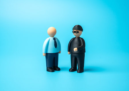 The swindler wants to deceive the office worker. Fraud, deception, and financial scams. Cybersecurity, financial fraud, corporate responsibility. Manipulation, vulnerability, and workplace corruption.の写真素材