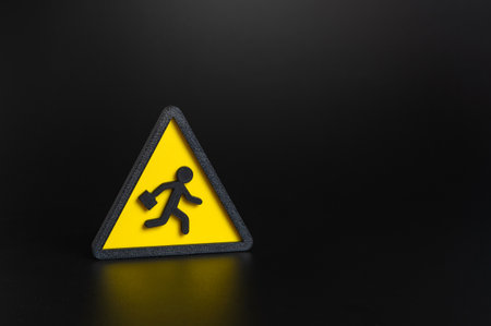 Symbol of a fleeing worker. Labor migration and departure of skilled professionals. Concept of workforce shortage, emigration, and global labor markets. Economics and policy.の写真素材