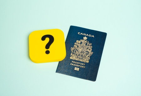 Canadian passport and question mark. FAQ on obtaining or reissuing a passport. Loss, reissuance, and name changes. Features you need to know when traveling.の写真素材