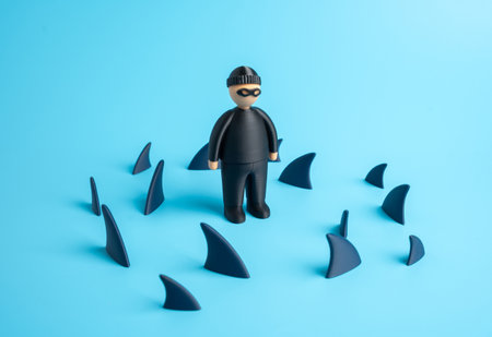 Scammers are surrounded by shark fins. Fight against crime, effective counteraction to crime. Financial fraud and cybercrime threats in the modern economy. Fraud detection, cybersecurityの写真素材