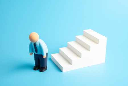 An office worker quits his career. Will give up in career growth. Professional stagnation, stress, lack of motivation. Lack of motivation, or career change. Concept of resignation, career fatigue.の写真素材