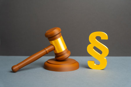 Judge's gavel and paragraph symbol. Laws and legislation. Adoption of laws, acts, and amendments to legislation. Regulation and fiscal. Legislative authority, justice, and government regulation.の写真素材