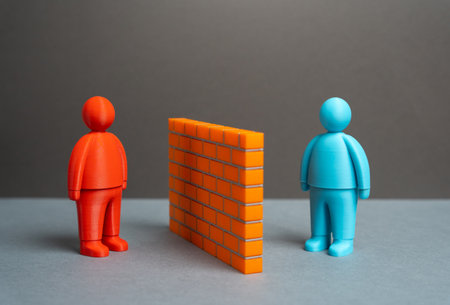 Two people separated by a brick wall. Misunderstandings and language barriers. Stereotypes. Finding common ground and gaining trust. Social conflict, isolation, cross-cultural understandingの写真素材