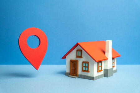 House and geolocation sign. Accessibility to infrastructure and commercial services. Urban development, property location, and connectivity. Logistics and urban accessibility discussions.の写真素材