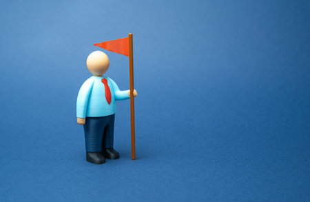 Businessman with a red flag. Leader and founder. Entrepreneurship, business development, management responsibility, and goal achievement in competitive markets.の写真素材