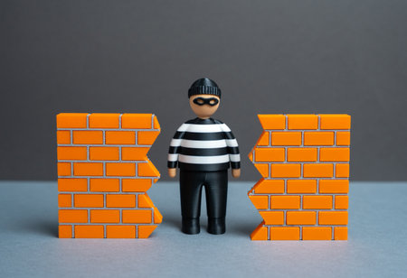 A breach in security. The threat of data theft and cybersecurity. System vulnerability and unauthorized access. Hacking risks, corporate espionageの写真素材