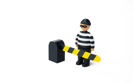 The criminal is stopped by a barrier. Security systems and perimeter control. Video surveillance and monitoring systems. Digital safety solutions for crime prevention.の写真素材