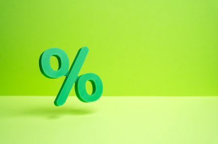 A green percentage symbol hovers in the air. Sale and discounts. Green holidays, great deals. Seasonal shopping, festive offers, and sustainable consumer behavior.の写真素材