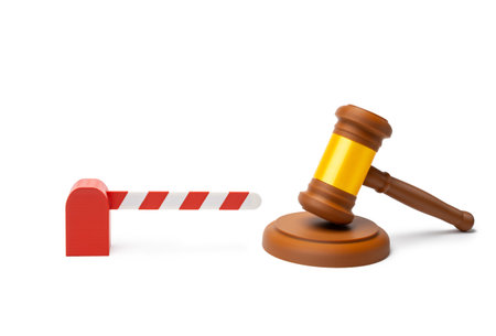 A barrier at the border and a judge's gavel. Migration regulation. Geopolitical analysis, legal decisions and international policy. Global mobility discussions and border control.の写真素材