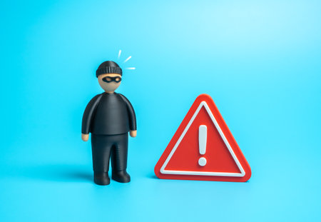 The criminal raised the alarm. Security and monitoring system against intruders and hackers. Cybersecurity. Danger of being robbed.の写真素材